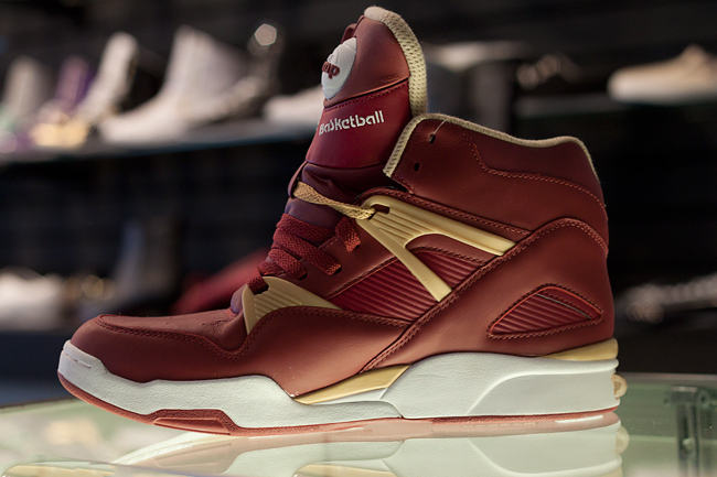 red and gold reebok pumps